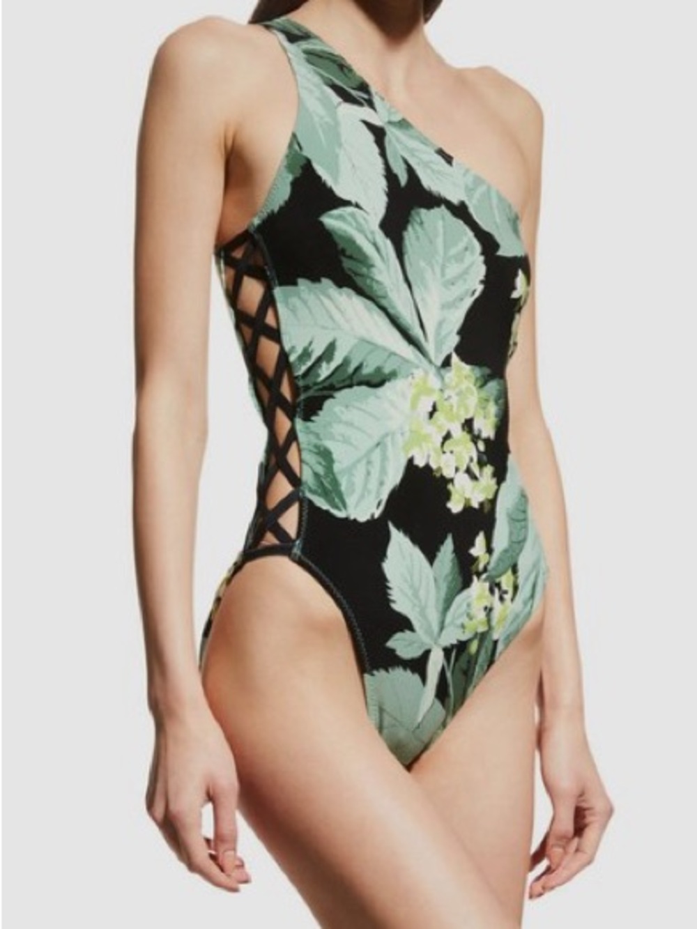 Norma Kamali One-Shoulder One-Piece Swimsuit in Black with Green Leaf Print